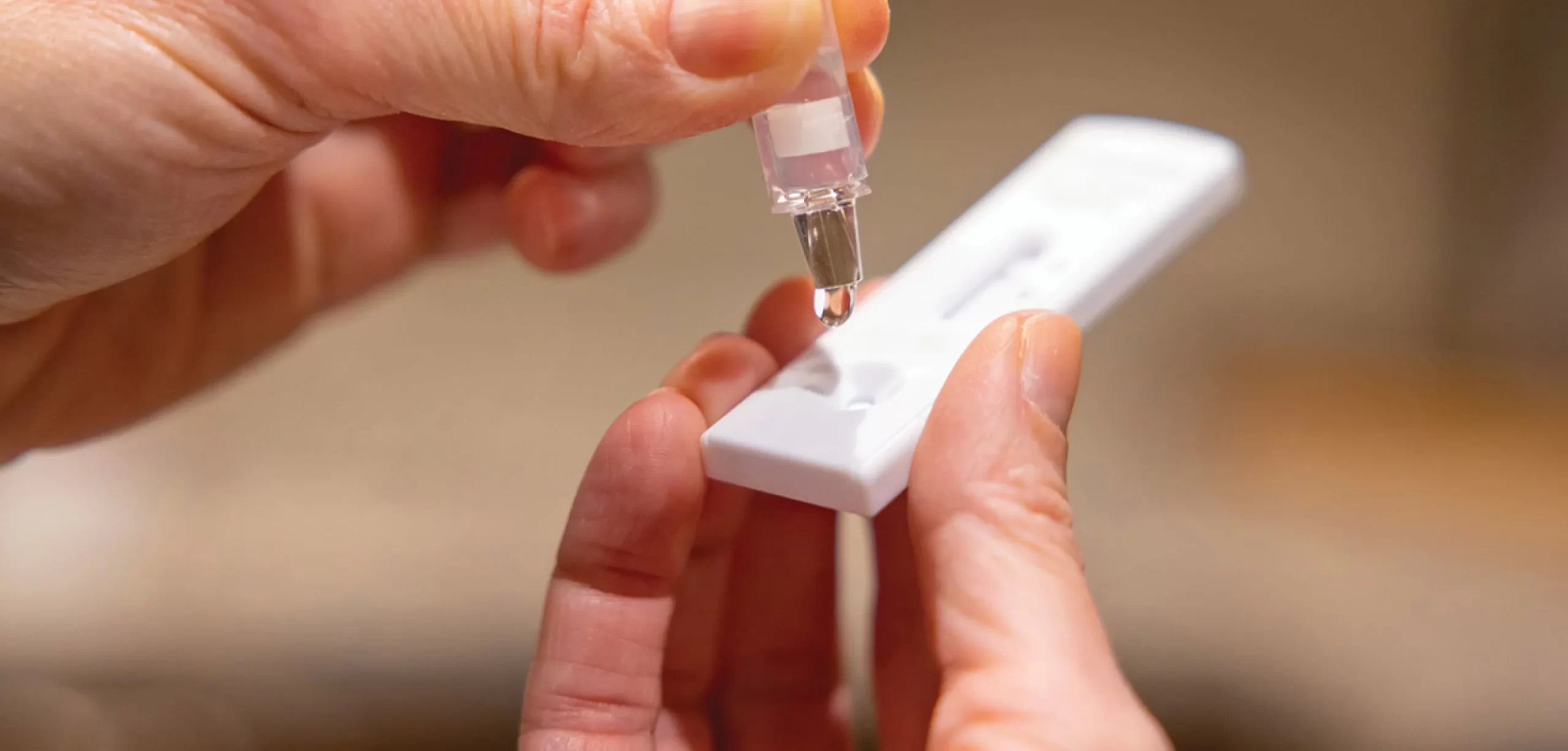 Close up of hand interacting with test